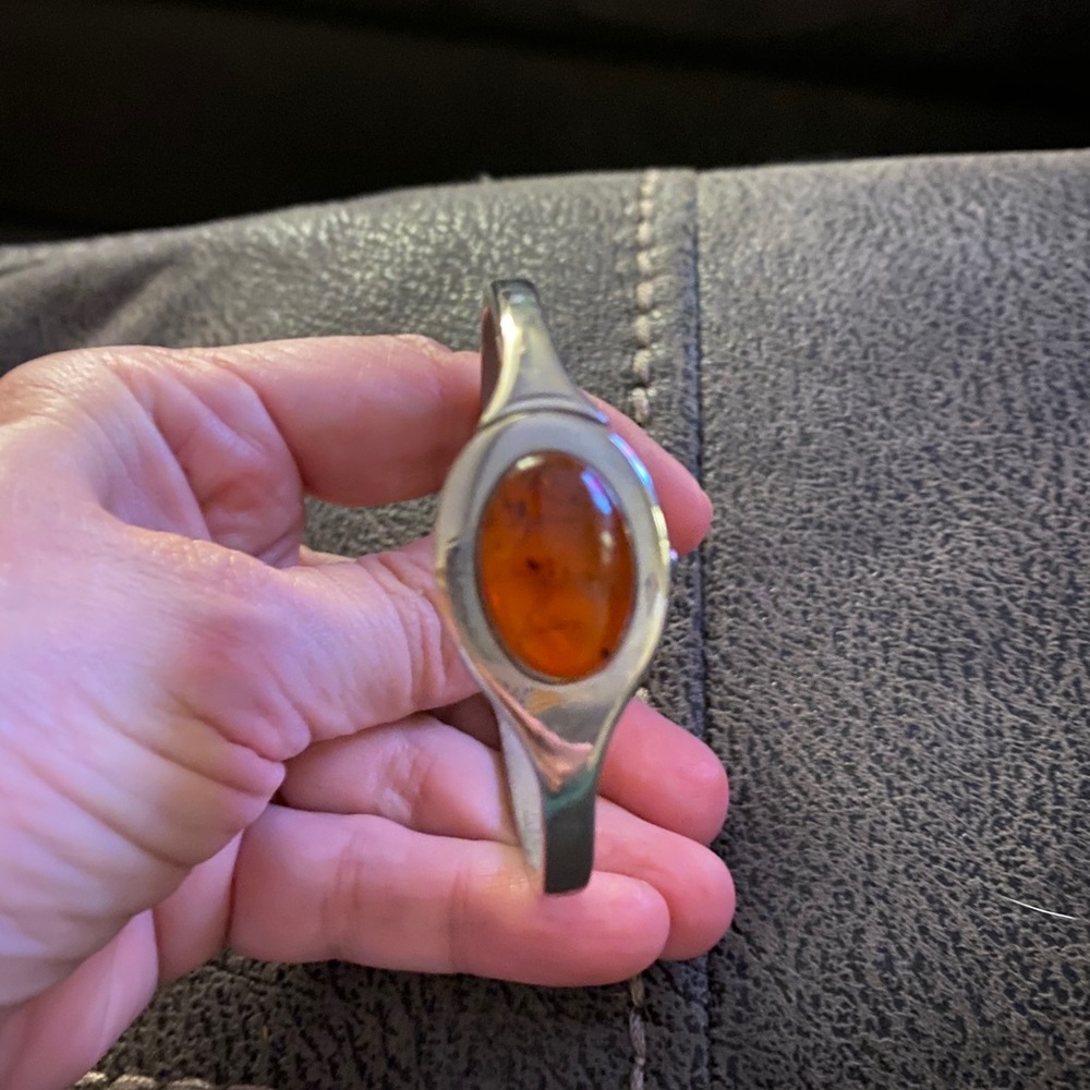 Silver tone bangle watch with amber.
